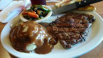 Plate of steak with mashed potatoes for the side