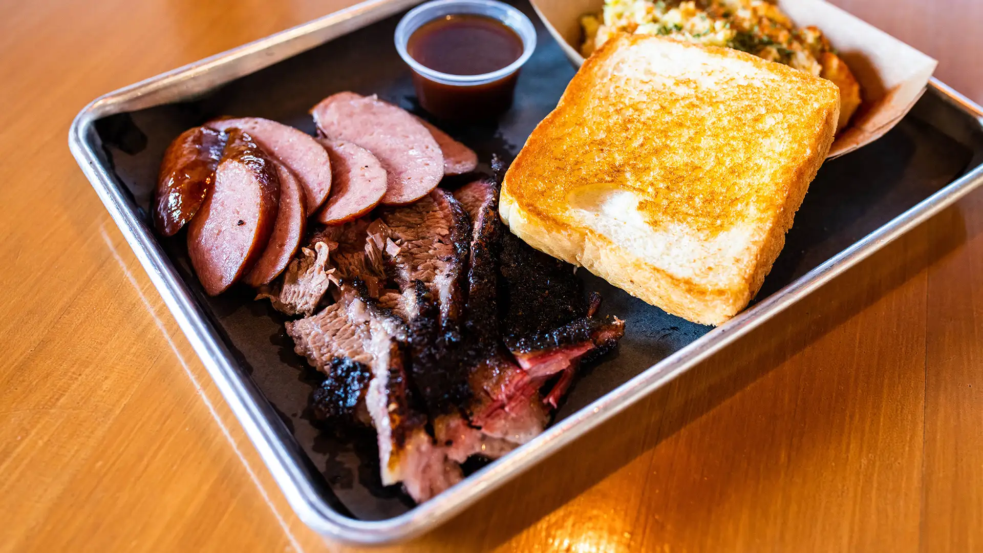 2 meat plate with brisket, sausage, and sides