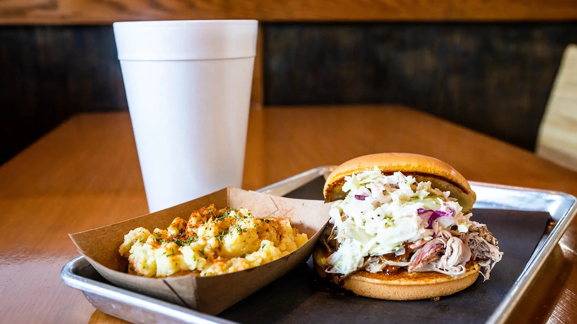 BBQ sandwich with a side of potato salad