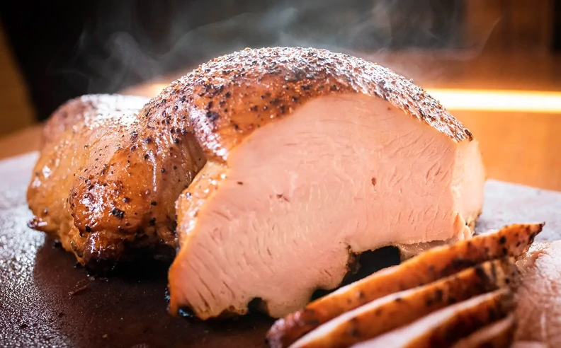 Sliced turkey breast on a cutting board