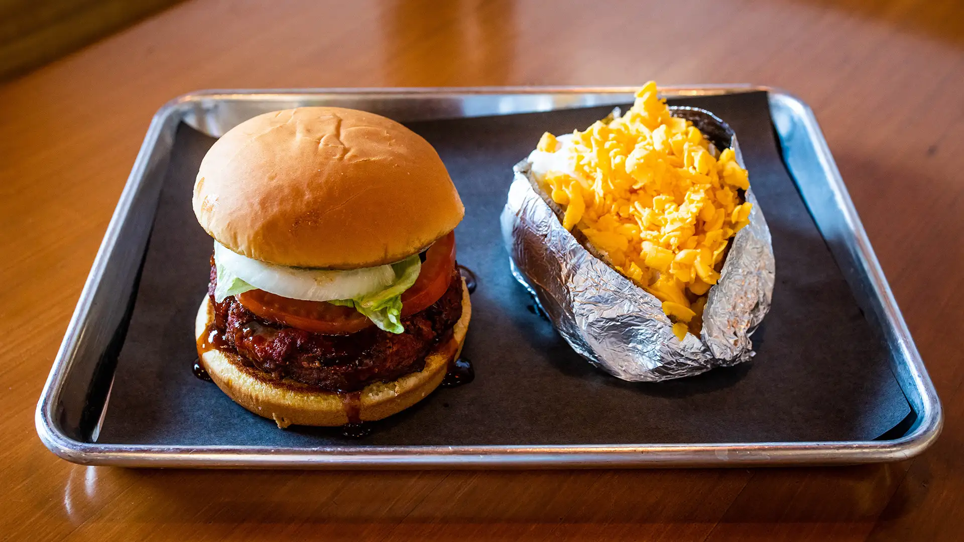 Burger with a smoked patty and a baked potato